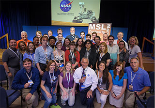NASA Administrator Charles Bolden, front center, poses for a group photograph with participants in the Mars Science Laboratory (MSL) NASA Social held at the Jet Propulsion Laboratory on Sunday, Aug. 5, 2012 in Pasadena, Calif.  The MSL Rover named Curiosity was designed to assess whether Mars ever had an environment able to support small life forms called microbes. Curiosity is due to land on Mars at 10:31 p.m. PDT on Aug. 5, 2012 (1:31 a.m. EDT on Aug. 6, 2012). Photo Credit: (NASA/Bill Ingalls)NASA Administrator Charles Bolden, front center, poses for a group photograph with participants in the Mars Science Laboratory (MSL) NASA Social held at the Jet Propulsion Laboratory on Sunday, Aug. 5, 2012 in Pasadena, Calif.  The MSL Rover named Curiosity was designed to assess whether Mars ever had an environment able to support small life forms called microbes. Curiosity is due to land on Mars at 10:31 p.m. PDT on Aug. 5, 2012 (1:31 a.m. EDT on Aug. 6, 2012). Photo Credit: (NASA /Bill Ingalls)